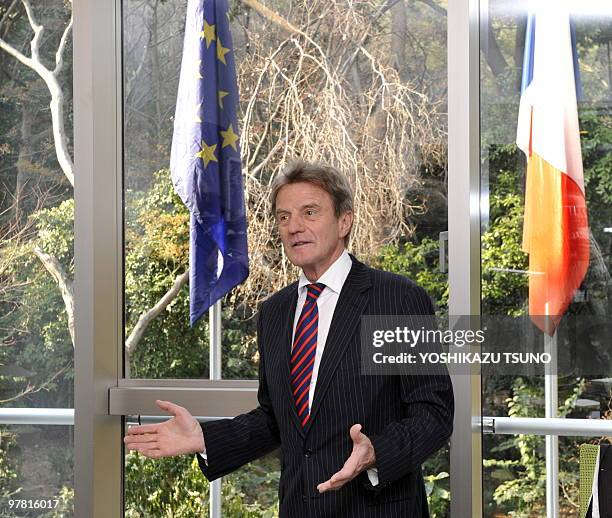 French Foreign Minister Bernard Kouchner talks to embassy staff as he visits the newly opened French Embassy in Tokyo on March 18, 2010. Kouchner is...