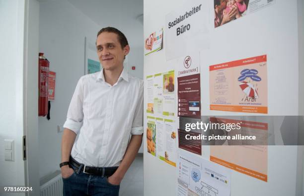 April 2018, Metzingen, Germany: Steffen Uebele, refugee and integration officer of the city of Metzingen, standing in a refugee shelter at the...