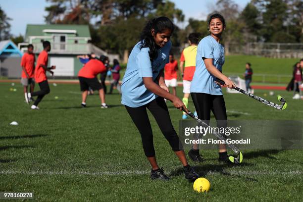 Students play hockey during the Olympic Refugee Sport Day at The Trusts Arena on June 19, 2018 in Auckland, New Zealand. The event saw refugees aged...