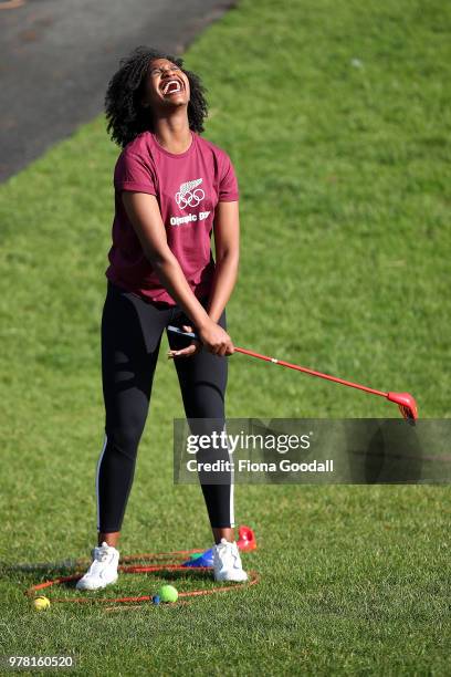 Christelle Ibambasi reacts to her golf swing during the Olympic Refugee Sport Day at The Trusts Arena on June 19, 2018 in Auckland, New Zealand. The...