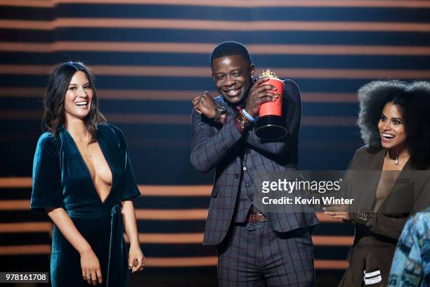 Actors Olivia Munn and Zazie Beetz react after James Shaw Jr. Was presented actor Chadwick Boseman's Best Hero award trophy for 'Black Panther'...