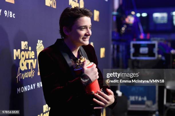 Actor Noah Schnapp poses with the Most Frightened Performance award for 'Stranger Things' during the 2018 MTV Movie And TV Awards at Barker Hangar on...