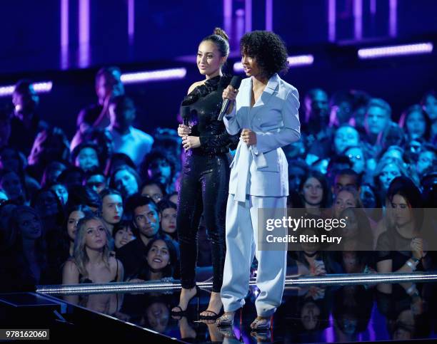 Actors Francia Raisa and Yara Shahidi speak onstage during the 2018 MTV Movie And TV Awards at Barker Hangar on June 16, 2018 in Santa Monica,...