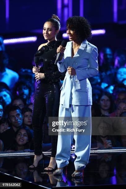 Actors Francia Raisa and Yara Shahidi speak onstage during the 2018 MTV Movie And TV Awards at Barker Hangar on June 16, 2018 in Santa Monica,...