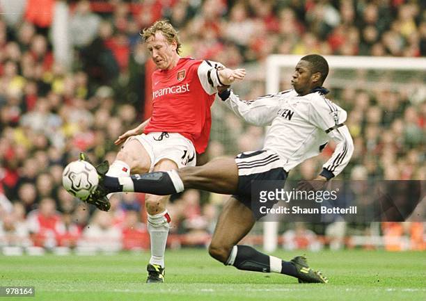 Ray Parlour of Arsenal hits the ball past Anthony Gardner of Spurs during the match between Arsenal v Tottenham Hotspur in the FA Carling Premiership...
