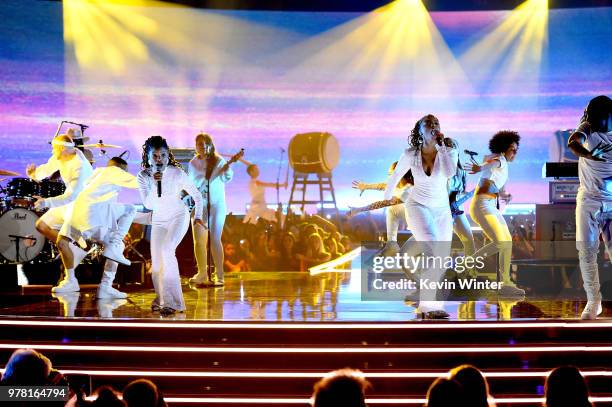 Recording artists Halle Bailey and Chloe Bailey of musical group Chloe X Halle perform onstage during the 2018 MTV Movie And TV Awards at Barker...