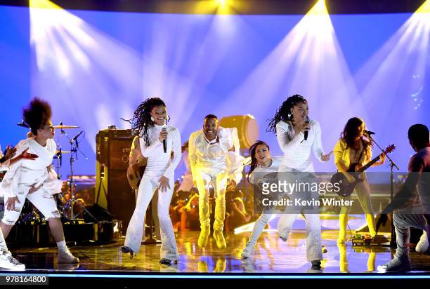 Recording artists Halle Bailey and Chloe Bailey of musical group Chloe X Halle perform onstage during the 2018 MTV Movie And TV Awards at Barker...