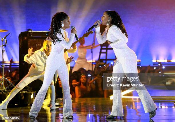 Recording artists Halle Bailey and Chloe Bailey of musical group Chloe X Halle perform onstage during the 2018 MTV Movie And TV Awards at Barker...