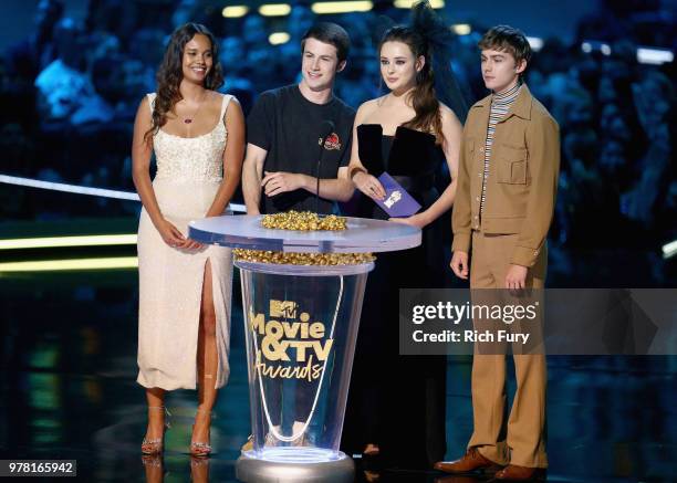 Actors Alisha Boe, Dylan Minnette, Katherine Langford, and Miles Heizer speak onstage during the 2018 MTV Movie And TV Awards at Barker Hangar on...