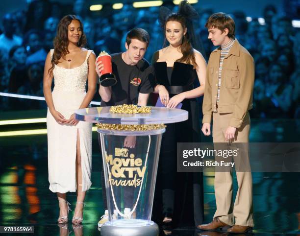 Actors Alisha Boe, Dylan Minnette, Katherine Langford, and Miles Heizer speak onstage during the 2018 MTV Movie And TV Awards at Barker Hangar on...