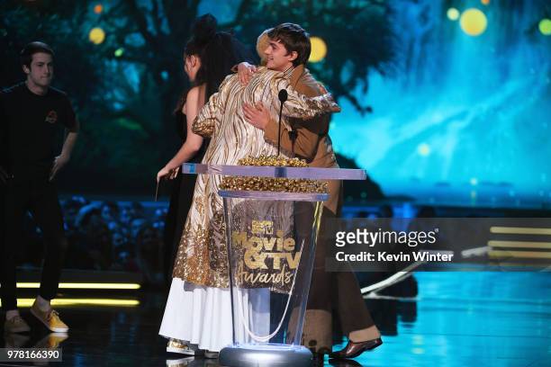 Actor Keiynan Lonsdale accepts the Best Kiss award for 'Love, Simon' from actor Miles Heizer onstage during the 2018 MTV Movie And TV Awards at...