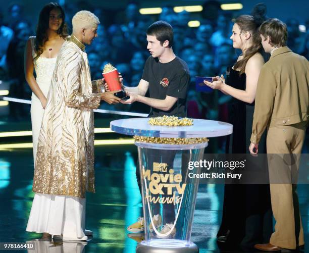 Actor Keiynan Lonsdale accepts the Best Kiss award for 'Love, Simon' from actors Alisha Boe, Dylan Minnette, Katherine Langford, and Miles Heizer...