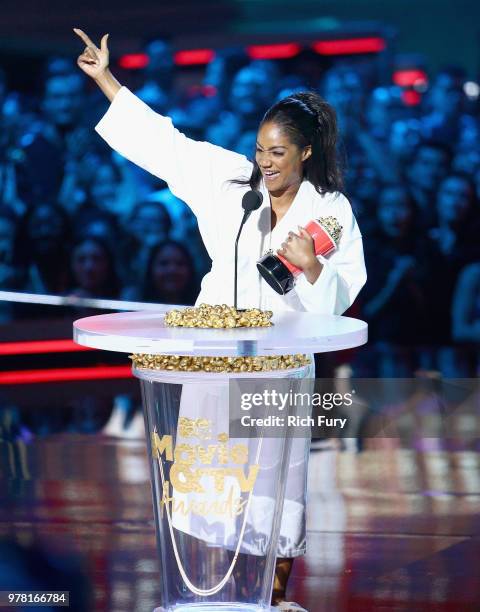 Actor and show host Tiffany Haddish accepts the Best Comedic Performance award for 'Girls Trip' onstage during the 2018 MTV Movie And TV Awards at...