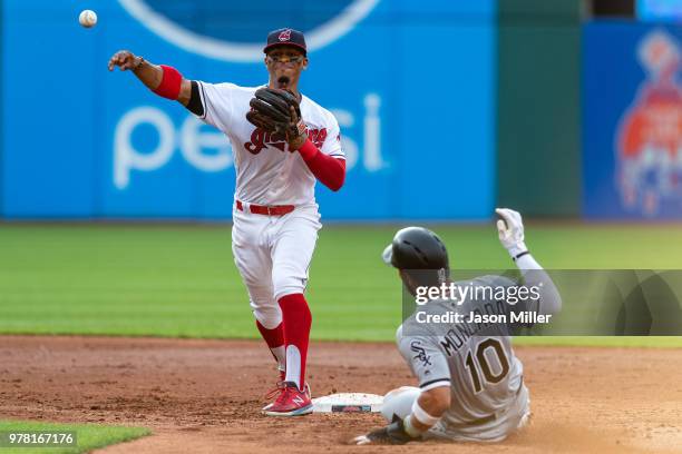 Shortstop Francisco Lindor of the Cleveland Indians throws out Yolmer Sanchez at first as Yoan Moncada of the Chicago White Sox is out at second for...