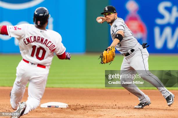 Edwin Encarnacion of the Cleveland Indians is out at second as Yonder Alonso is thrown out at first by third baseman Yolmer Sanchez of the Chicago...