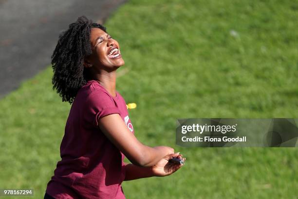 Christelle Ibambasi reacts to her golf swing during the Olympic Refugee Sport Day at The Trusts Arena on June 19, 2018 in Auckland, New Zealand. The...