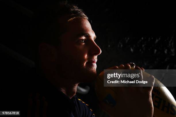 Tom Mitchell poses during a Hawthorn Hawks AFL press conference at Waverley Park on June 19, 2018 in Melbourne, Australia.