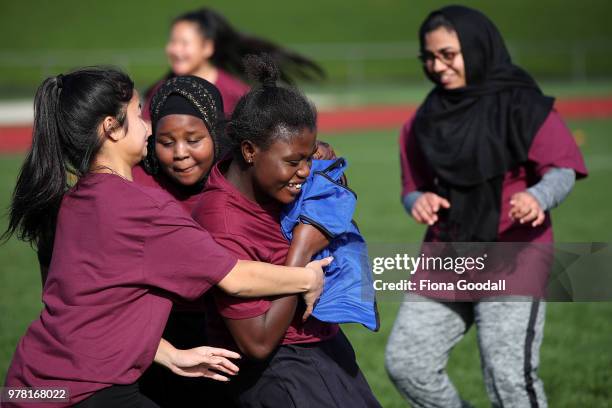 Students play tag to warm up for football during the Olympic Refugee Sport Day at The Trusts Arena on June 19, 2018 in Auckland, New Zealand. The...