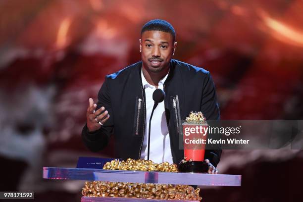 Actor Michael B. Jordan accepts the Best Villain award for 'Black Panther' onstage during the 2018 MTV Movie And TV Awards at Barker Hangar on June...