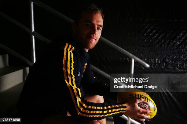 Tom Mitchell poses during a Hawthorn Hawks AFL press conference at Waverley Park on June 19, 2018 in Melbourne, Australia.