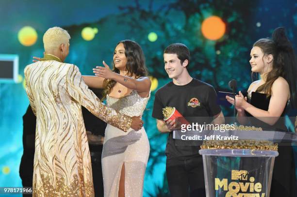 Actor Keiynan Lonsdale accepts award from Alisha Boe, Dylan Minnette, and Katherine Langford onstage at the 2018 MTV Movie And TV Awards at Barker...