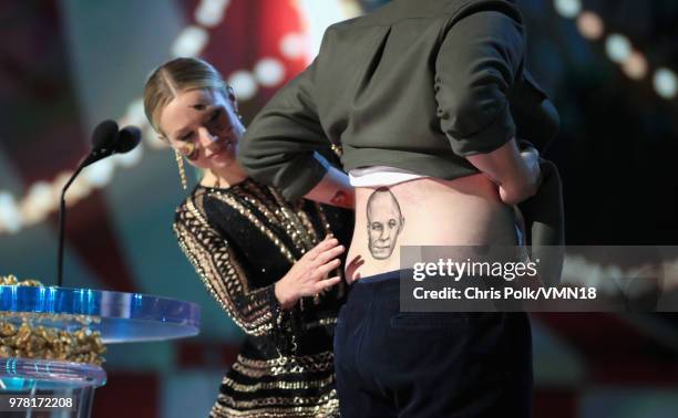 Actors Kristen Bell and Seth Rogen speak onstage during the 2018 MTV Movie And TV Awards at Barker Hangar on June 16, 2018 in Santa Monica,...