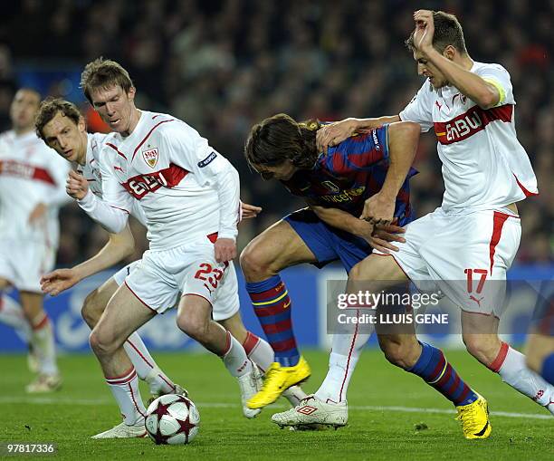 Barcelona's Swedish forward Zlatan Ibrahimovic vies with Stuttgart's French defender Matthieu Delpierre and Stuttgart's Belarus midfielder Aliaksandr...