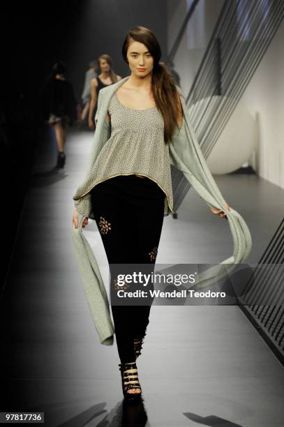 Model showcases designs on the catwalk by This is Genevieve as part of L'Oreal Paris Runway 5 on the fourth day of the 2010 L'Oreal Melbourne Fashion...