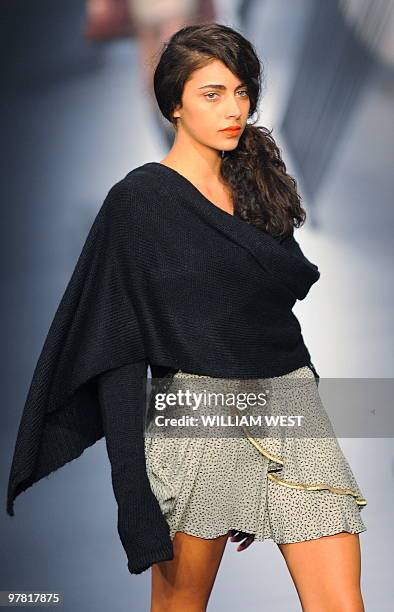 Model parades during a show by Australian label This is Genevieve during the Melbourne Fashion Festival, in Melbourne on March 18, 2010. The Festival...