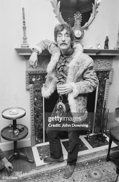 John Lennon wearing an afghan coat and a sporran at the press launch for the Beatles' new album 'Sergeant Pepper's Lonely Hearts Club Band', held at...