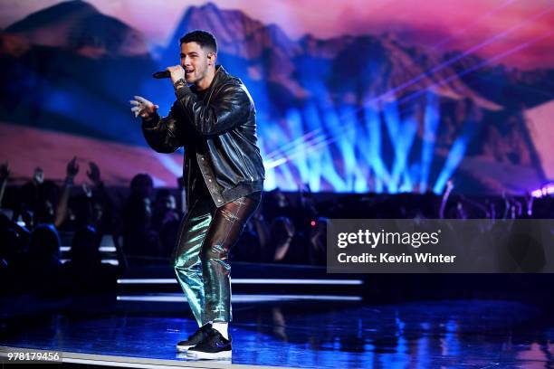 Recording artist Nick Jonas performs onstage during the 2018 MTV Movie And TV Awards at Barker Hangar on June 16, 2018 in Santa Monica, California.