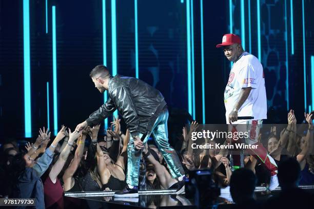 Recording artist Nick Jonas and DJ Mustard perform onstage during the 2018 MTV Movie And TV Awards at Barker Hangar on June 16, 2018 in Santa Monica,...