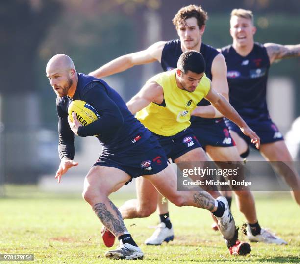 Nathan Jones of the Demons runs with the ball during a Melbourne Demons AFL training session at Gosch's Paddock on June 19, 2018 in Melbourne,...