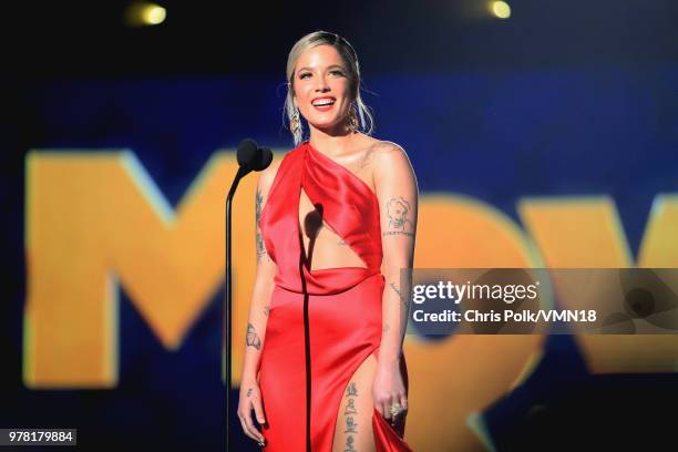 Recording artist Halsey speaks onstage during the 2018 MTV Movie And TV Awards at Barker Hangar on June 16, 2018 in Santa Monica, California.