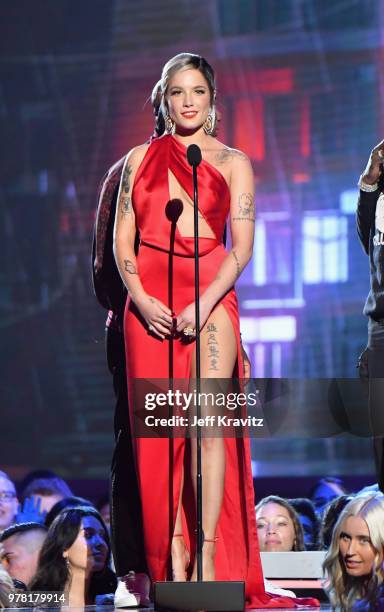 Halsey speaks onstage at the 2018 MTV Movie And TV Awards at Barker Hangar on June 16, 2018 in Santa Monica, California.