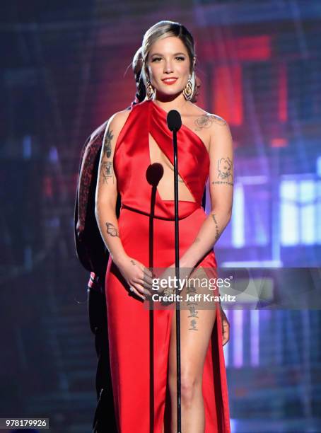 Halsey speaks onstage at the 2018 MTV Movie And TV Awards at Barker Hangar on June 16, 2018 in Santa Monica, California.