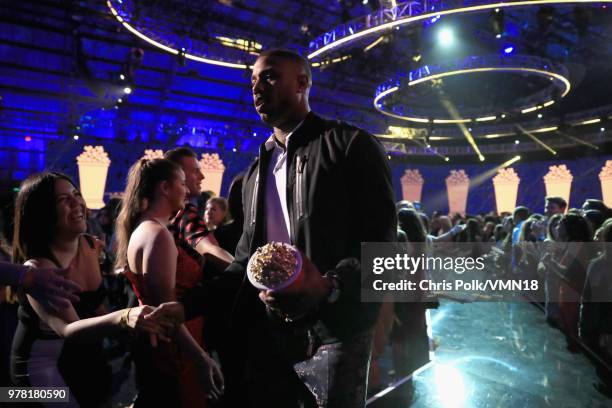 Actor Michael B. Jordan, winner of the Best Villain award for 'Black Panther', walks off stage during the 2018 MTV Movie And TV Awards at Barker...