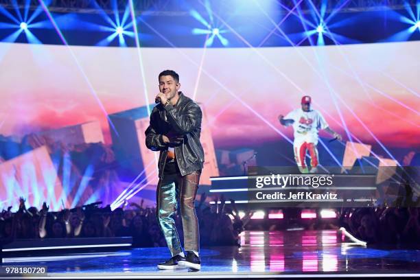 Nick Jonas and Mustard perform onstage at the 2018 MTV Movie And TV Awards at Barker Hangar on June 16, 2018 in Santa Monica, California.