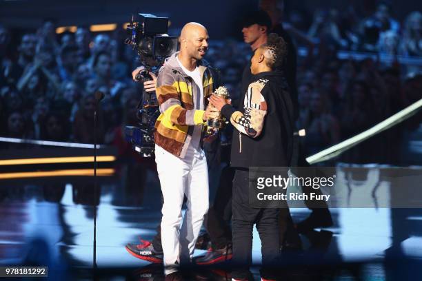 Actor/writer Lena Waithe accepts the MTV Trailblazer Award from rapper/actor Common onstage during the 2018 MTV Movie And TV Awards at Barker Hangar...