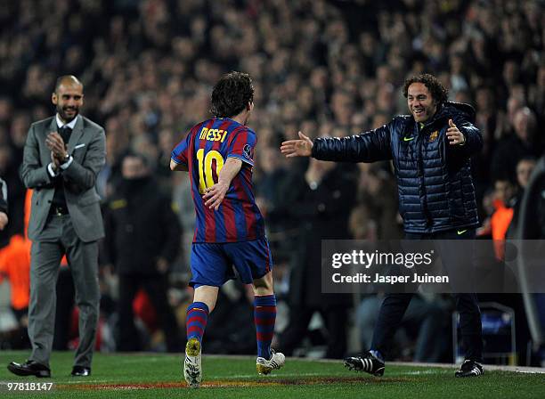 Lionel Messi of FC Barcelona runs in celebration towards his teammate Gabriel Milito and head coach Josep Guardiola after scoring his sides third...