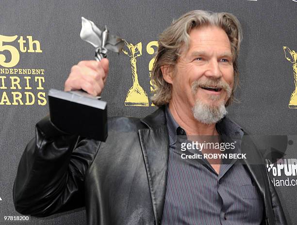Jeff Bridges holds the best male actor award for 'Crazy Heart' in the press room at the 25th annual Film Independent Spirit Awards at LA Live in...