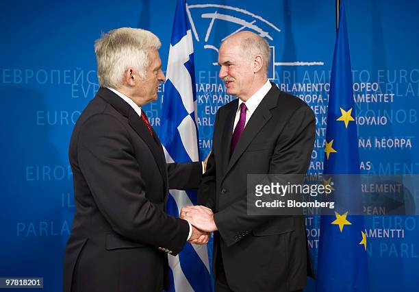 Jerzy Buzek, president of the European Parliament, left, greets George Papandreou, Greece's prime minister, at the European Union Parliament...