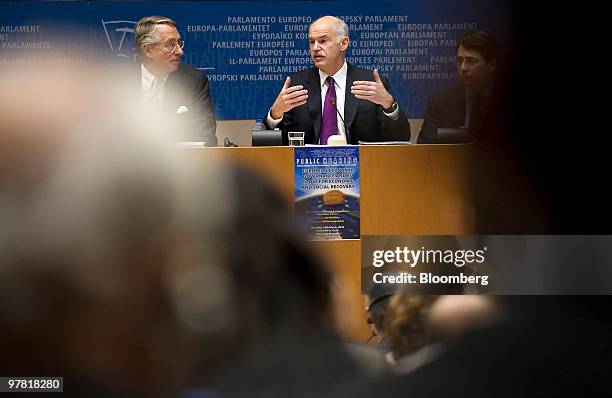 George Papandreou, Greece's prime minister, center, speaks at the European Union Parliament headquarters in Brussels, Belgium, on Thursday, March 18,...