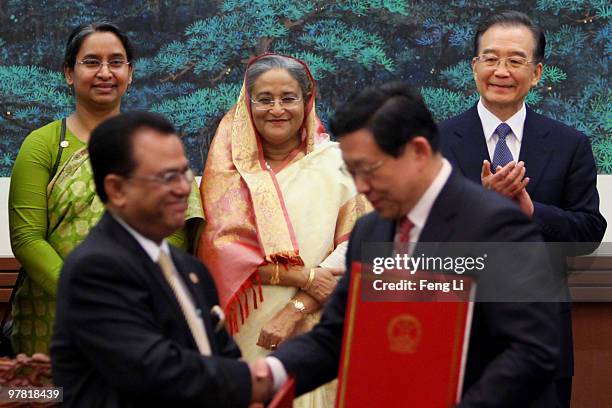 Premier of the People's Republic of Bangladesh Ms. Sheikh Hasina and Chinese Premier Wen Jiabao attend a signing ceremony in the Great Hall of the...