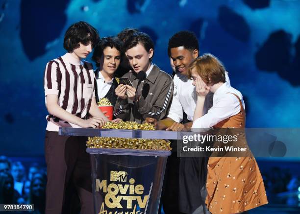 Actors Finn Wolfhard, Jack Dylan Grazer, Jaeden Lieberher, Chosen Jacobs, and Sophia Lillis accept the Best On-Screen Team award for 'It' onstage...