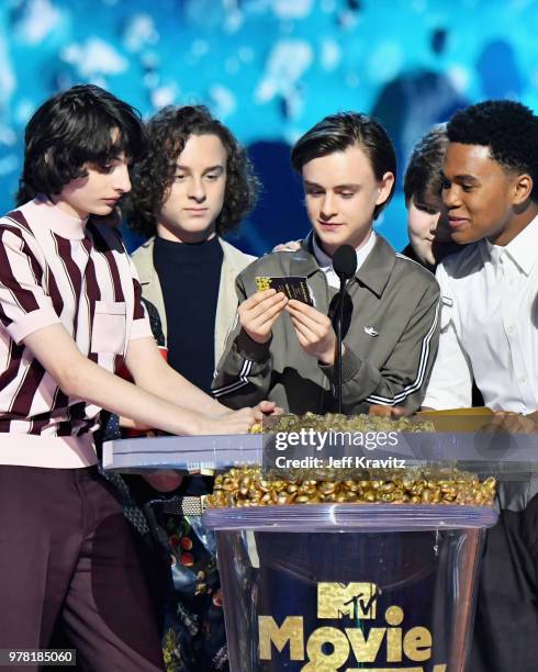 Actors Finn Wolfhard, Jack Dylan Grazer, Wyatt Oleff, Jaeden Lieberher, Jeremy Ray Taylor, and Chosen Jacobs accept award onstage at the 2018 MTV...