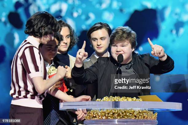Actors Finn Wolfhard, Jack Dylan Grazer, Wyatt Oleff, Jaeden Lieberher, and Jeremy Ray Taylor accept award onstage at the 2018 MTV Movie And TV...