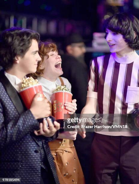 Actors Jack Dylan Grazer, Sophia Lillis and Finn Wolfhard, winners of Best On-Screen Team award for 'It', attend the 2018 MTV Movie And TV Awards at...