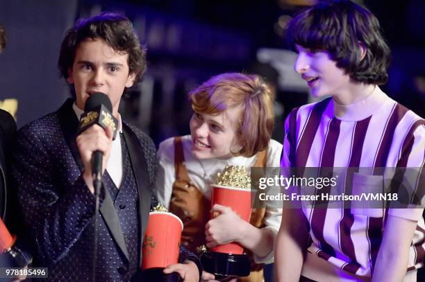 Actors Jack Dylan Grazer, Sophia Lillis and Finn Wolfhard, winners of Best On-Screen Team award for 'It', attend the 2018 MTV Movie And TV Awards at...