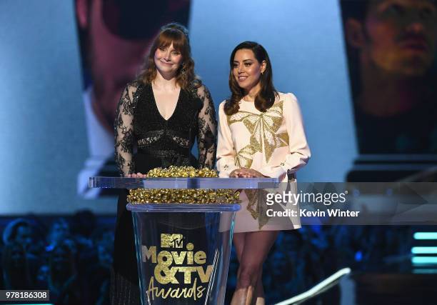 Actors Bryce Dallas Howard and Aubrey Plaza speak onstage during the 2018 MTV Movie And TV Awards at Barker Hangar on June 16, 2018 in Santa Monica,...